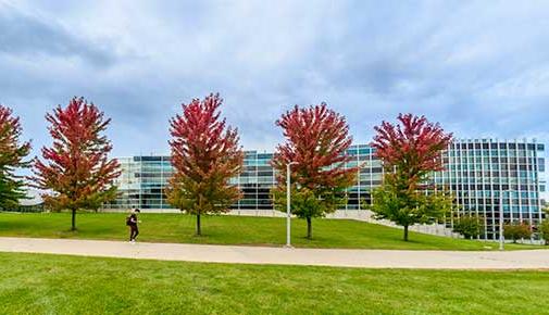 Student walking outside the Administration Building